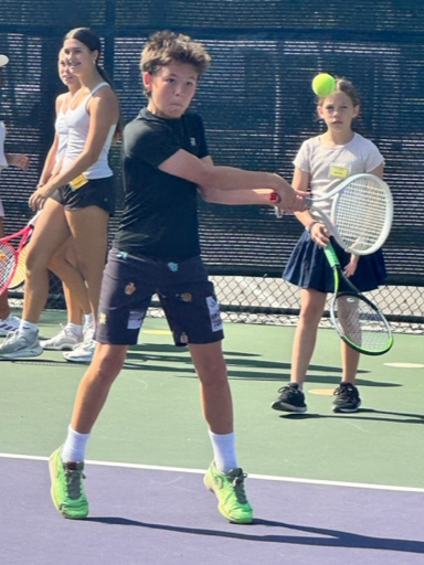 kid hitting essential ball