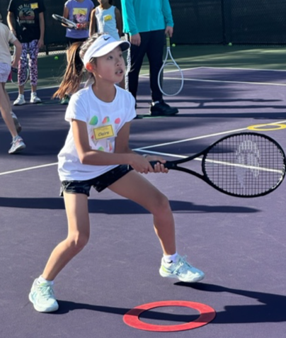 kid hitting green ball